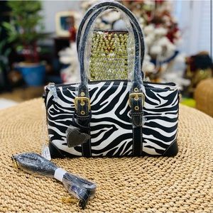 Zebra print handbag with boutique tag